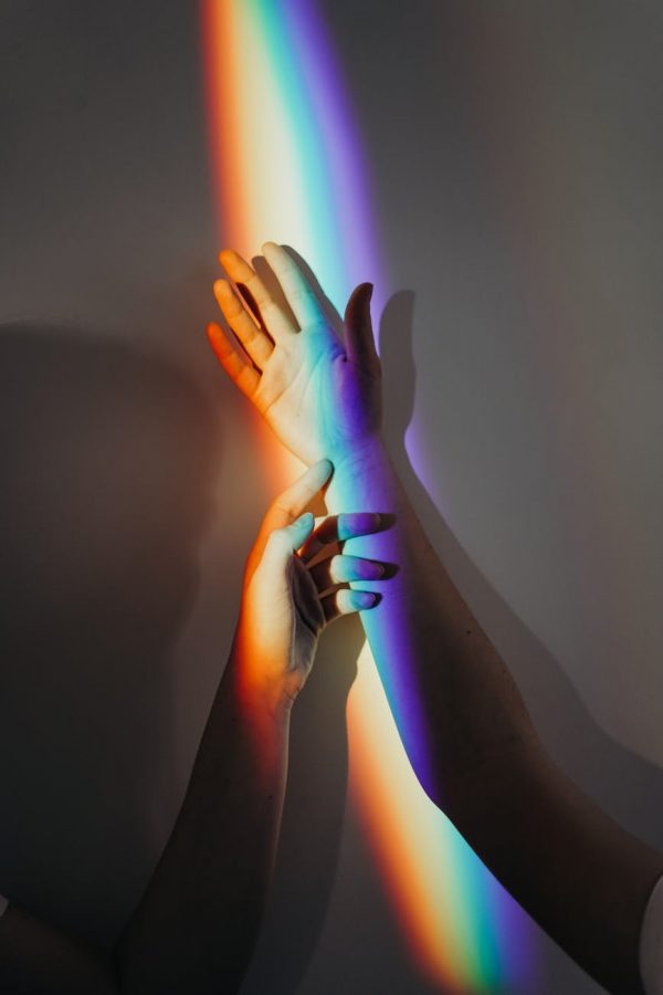 lesbian gay bisexual transgender queer lgbt pride rainbow colors shining on hands
